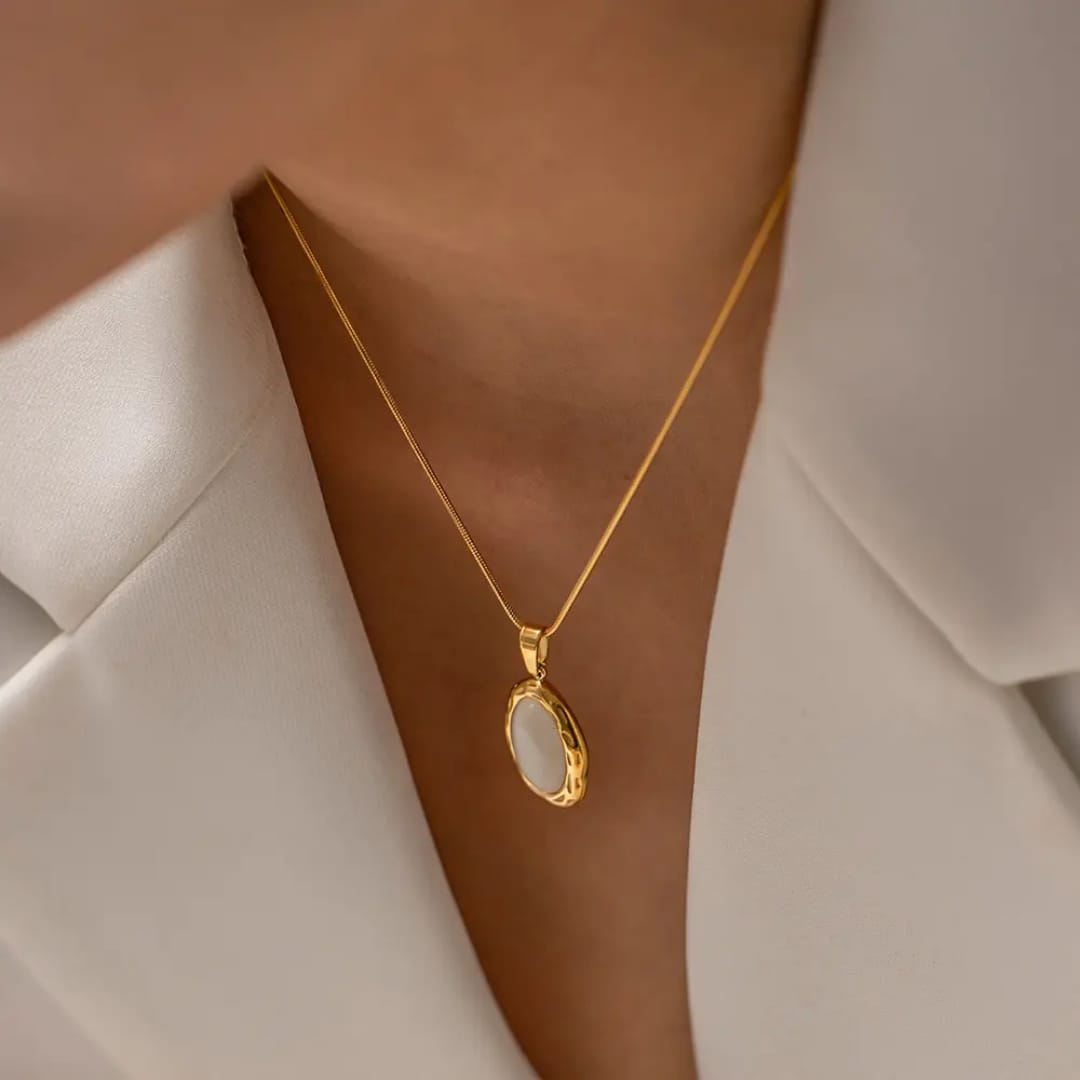 Gold necklace with an oval pendant