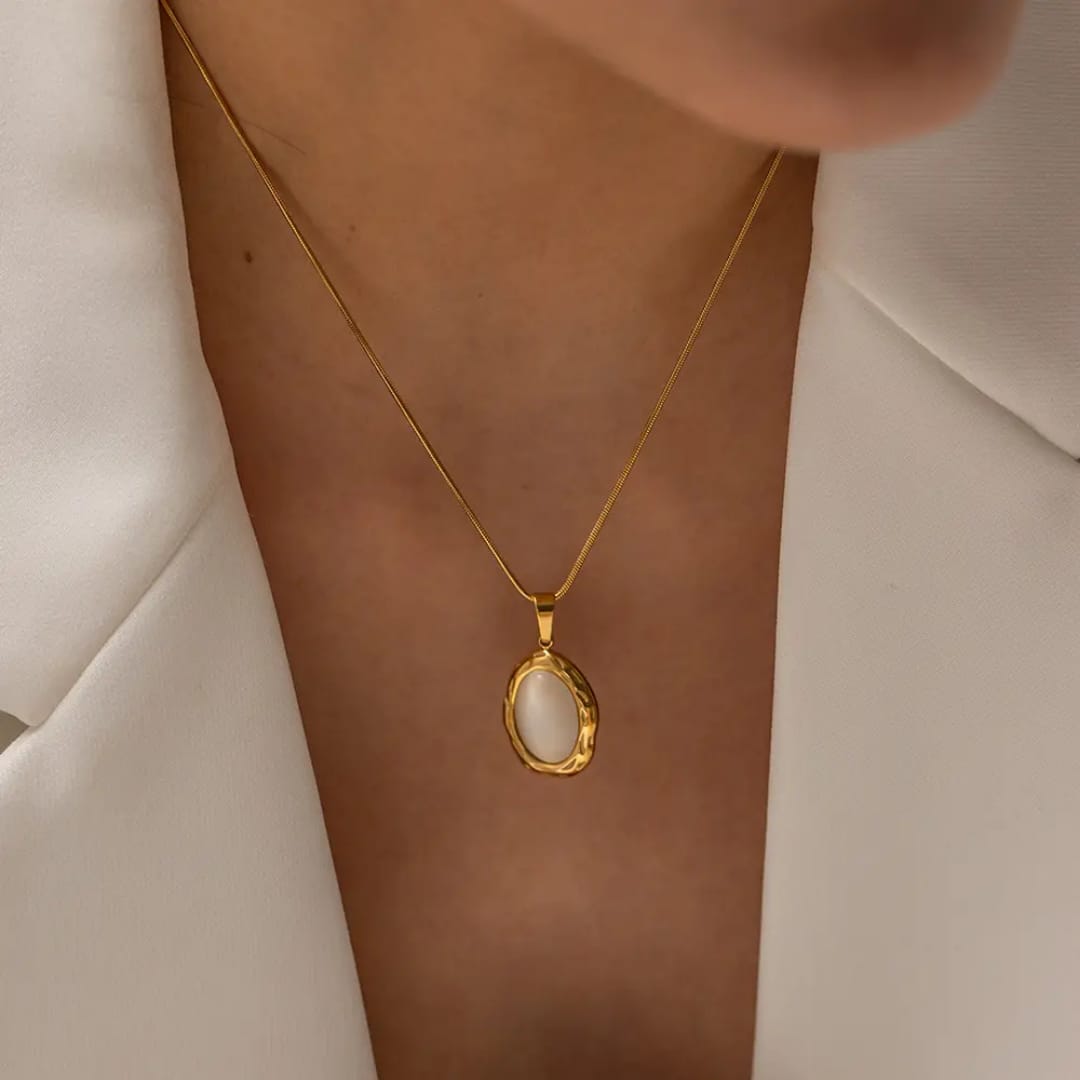 Gold necklace with an oval pendant
