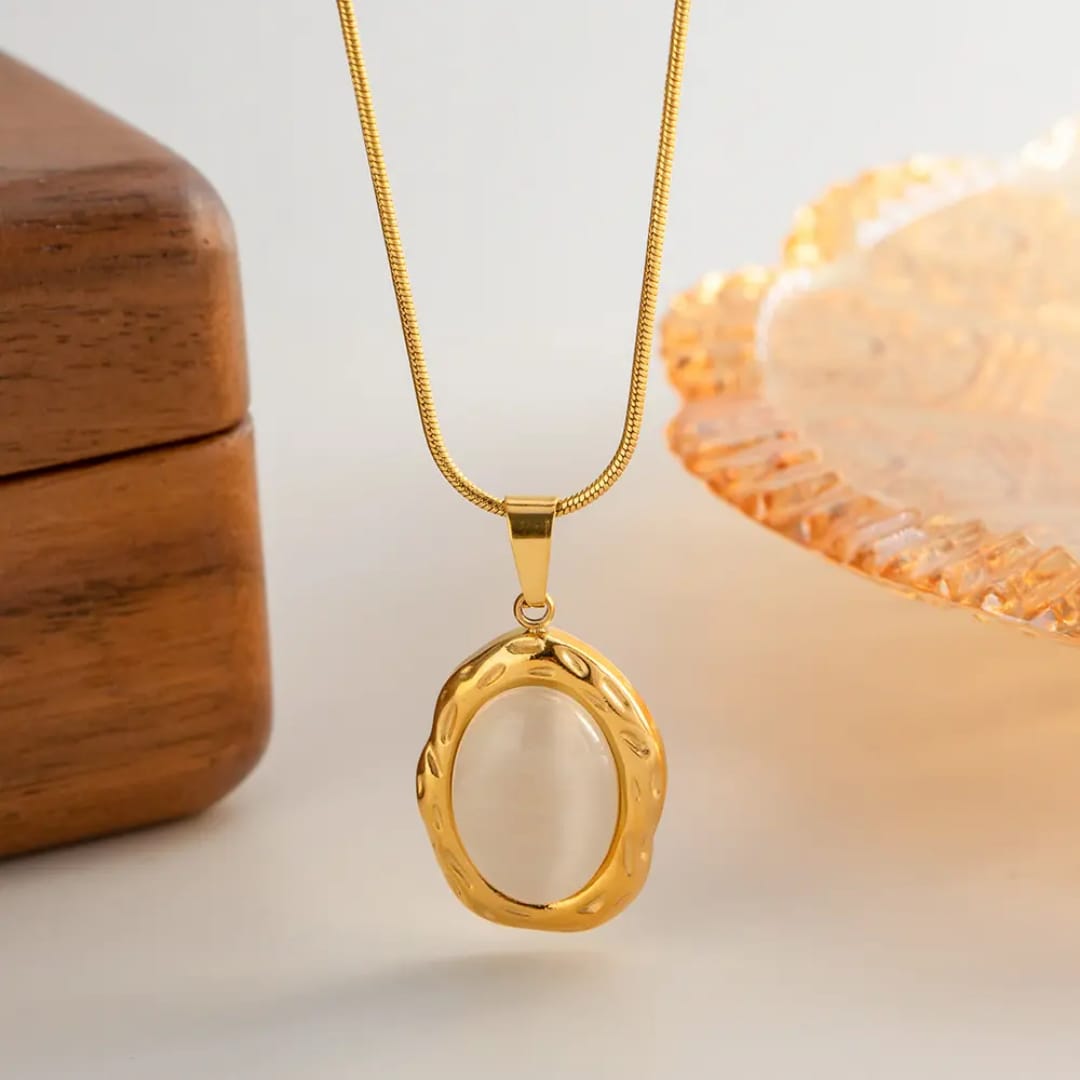 Gold necklace with an oval pendant