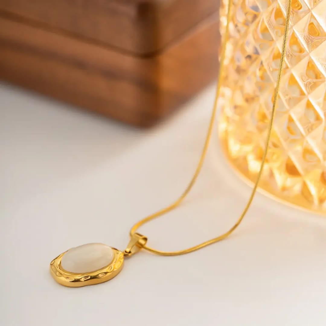 Gold necklace with an oval pendant