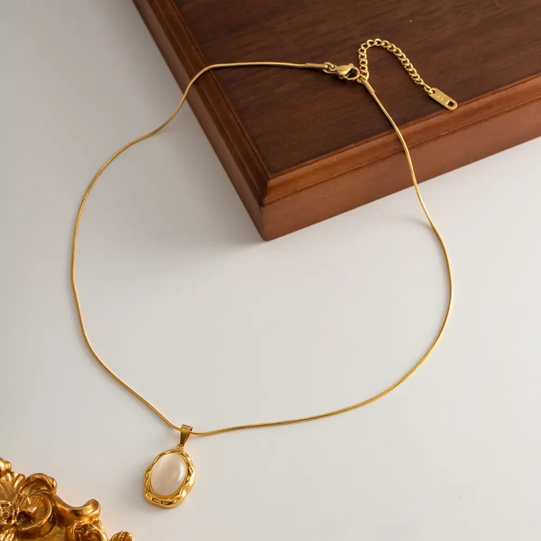 Gold necklace with an oval pendant
