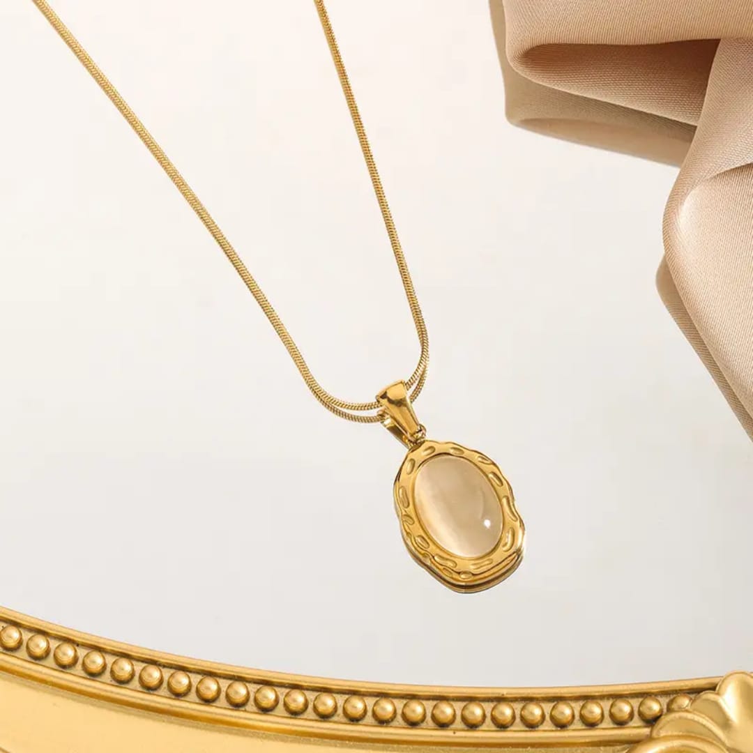 Gold necklace with an oval pendant