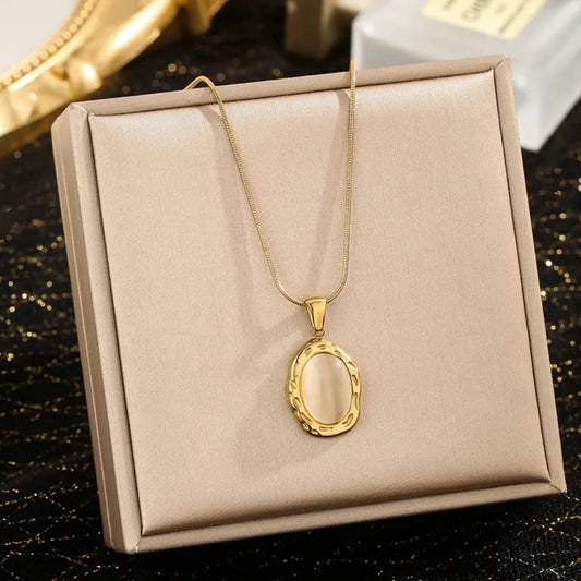 Gold necklace with an oval pendant